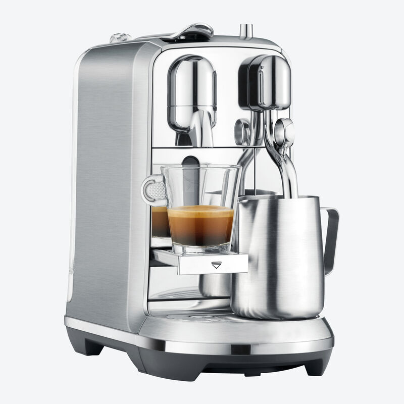 La machine à capsules prépare des spécialités de café à la mousse de lait onctueuse Photo 3